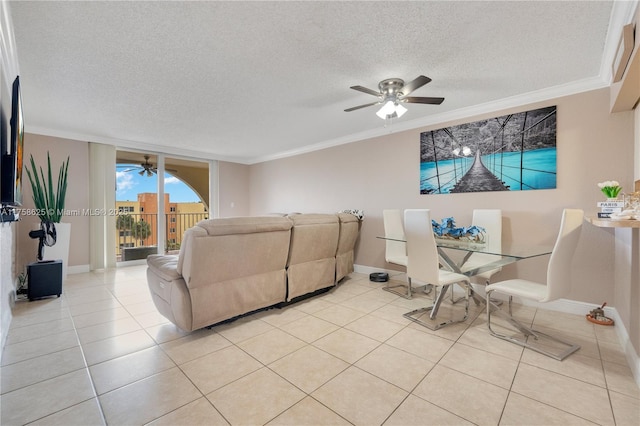 living room featuring light tile patterned floors, baseboards, a ceiling fan, a textured ceiling, and crown molding