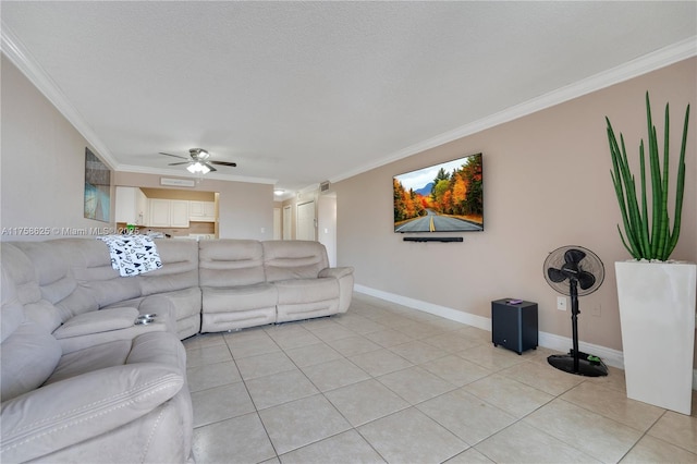 living area with light tile patterned floors, ornamental molding, a ceiling fan, and baseboards