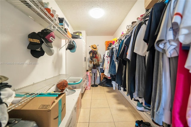 walk in closet featuring light tile patterned floors