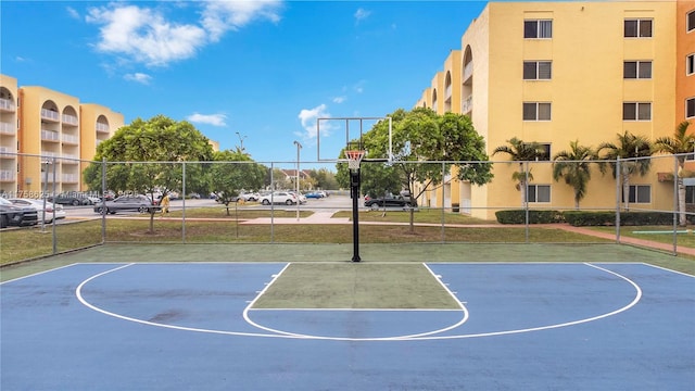 view of basketball court featuring community basketball court and fence