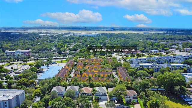 birds eye view of property with a residential view