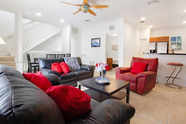 living room featuring ornamental molding, recessed lighting, light tile patterned flooring, and visible vents