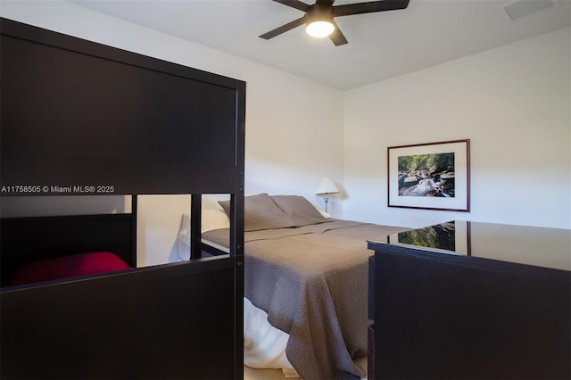 bedroom with ceiling fan and visible vents