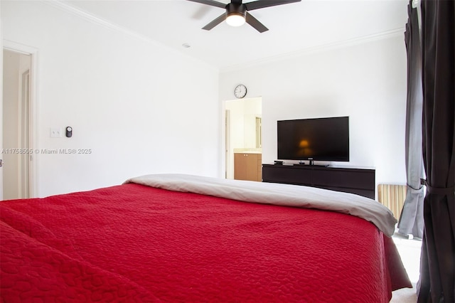 bedroom with ornamental molding, a ceiling fan, and ensuite bathroom