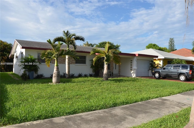 ranch-style house with a front yard, driveway, an attached garage, and stucco siding