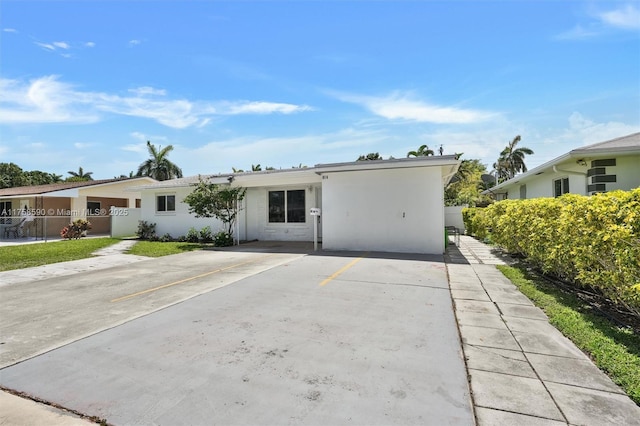 814 NE 4th St, Hallandale Beach, FL 33009 - single story home with driveway, fence, and stucco siding