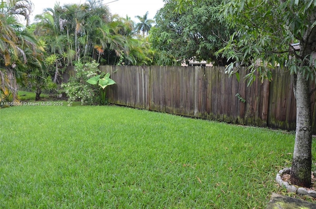 view of yard with fence