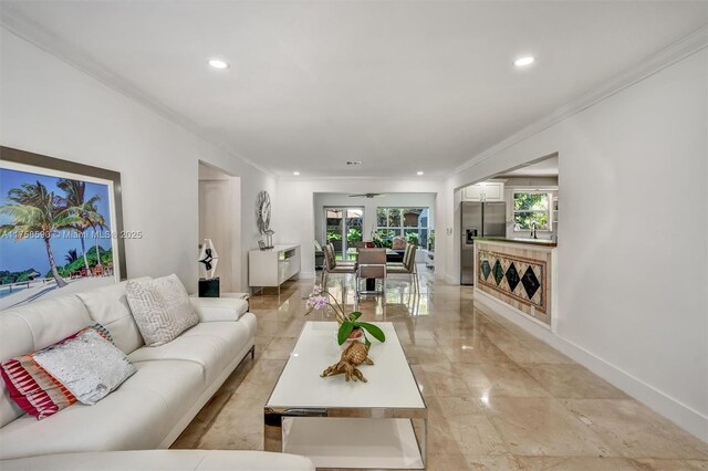814 NE 4th St, Hallandale Beach, FL 33009 - living area with recessed lighting, marble finish floor, baseboards, and crown molding