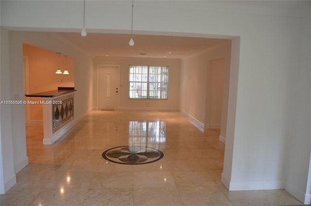 interior space with marble finish floor and baseboards