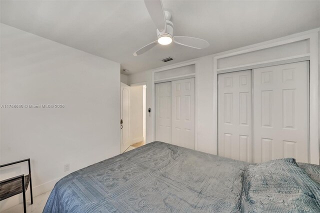 814 NE 4th St, Hallandale Beach, FL 33009 - bedroom featuring visible vents, baseboards, multiple closets, and ceiling fan