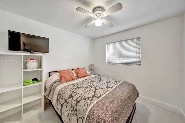 814 NE 4th St, Hallandale Beach, FL 33009 - bedroom with baseboards, a ceiling fan, and marble finish floor