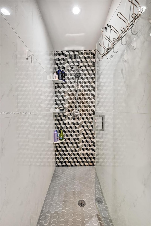 814 NE 4th St, Hallandale Beach, FL 33009 - bathroom featuring a tile shower, recessed lighting, and tile patterned flooring