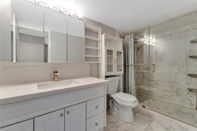 full bath featuring toilet, marble finish floor, a marble finish shower, and vanity