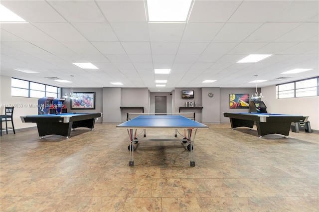 rec room with pool table, a paneled ceiling, and baseboards