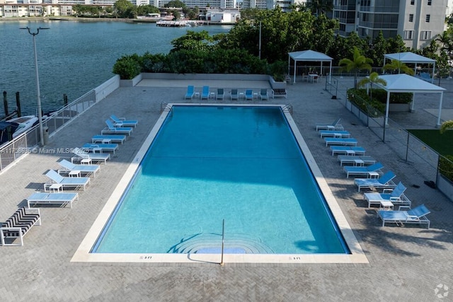 community pool featuring a water view