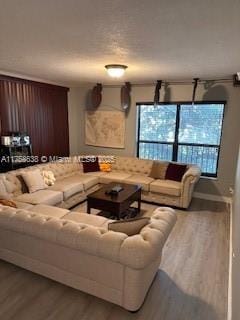 living room featuring baseboards and wood finished floors