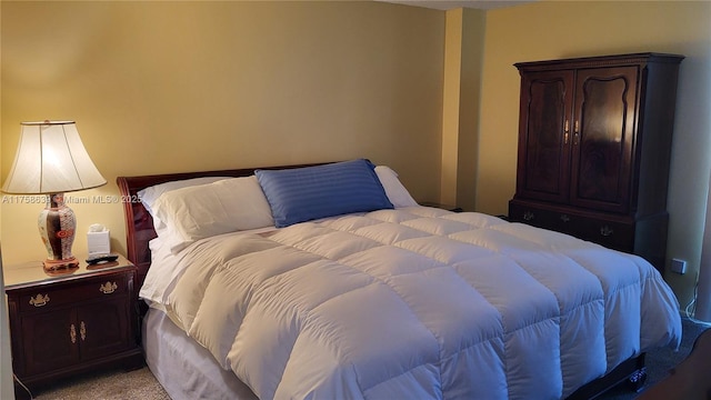 bedroom with light colored carpet