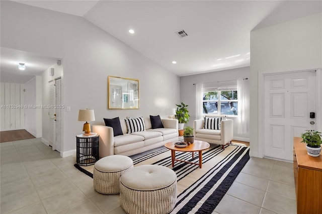 living room with visible vents, recessed lighting, light tile patterned floors, baseboards, and vaulted ceiling