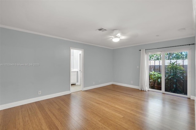 spare room featuring visible vents, baseboards, ceiling fan, ornamental molding, and light wood-style floors