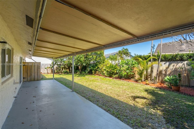 view of patio / terrace featuring fence