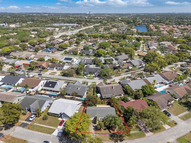 birds eye view of property with a residential view