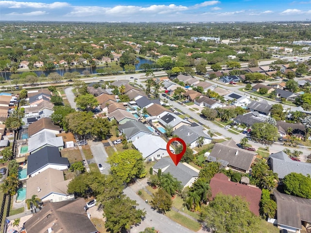 bird's eye view with a residential view and a water view