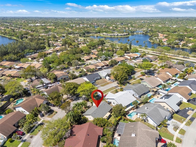 aerial view featuring a residential view and a water view