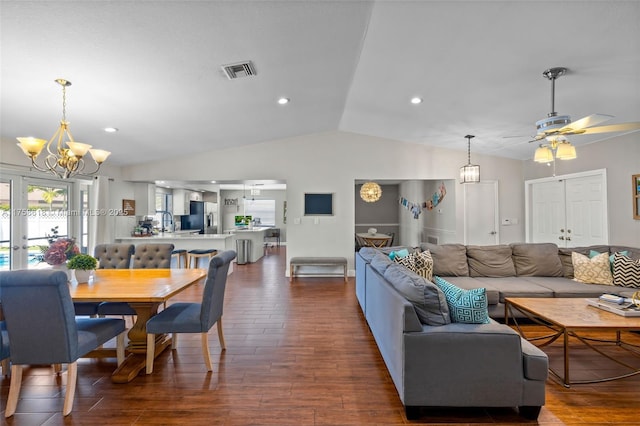 living room with visible vents, dark wood finished floors, lofted ceiling, french doors, and recessed lighting