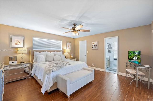 bedroom featuring a ceiling fan, baseboards, dark wood-style flooring, and ensuite bathroom