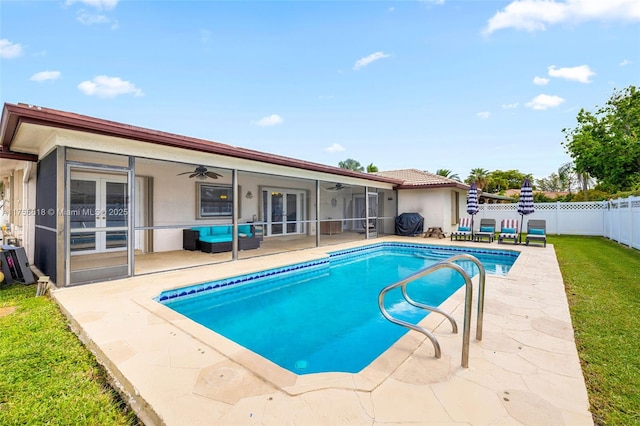 view of pool featuring a fenced in pool, a patio, ceiling fan, a fenced backyard, and french doors