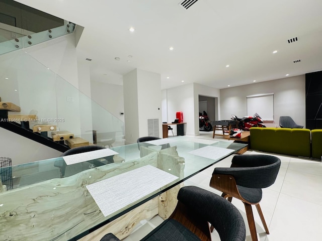 tiled dining area featuring visible vents and recessed lighting