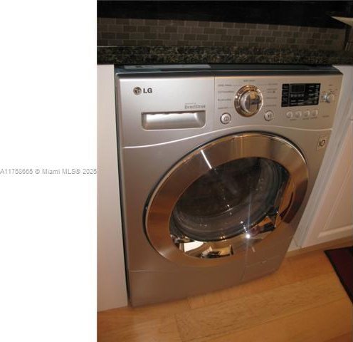 laundry area featuring washer / dryer and laundry area