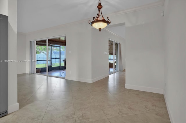 unfurnished room with ornamental molding, baseboards, and light tile patterned floors