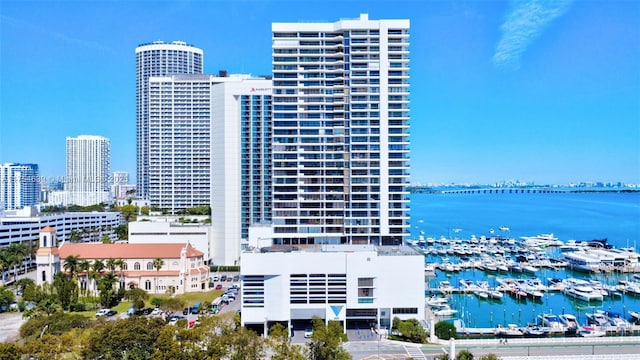 exterior space featuring a water view and a view of city