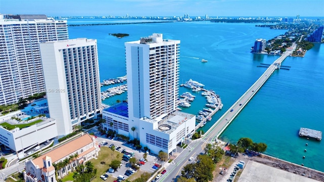 bird's eye view featuring a water view and a city view