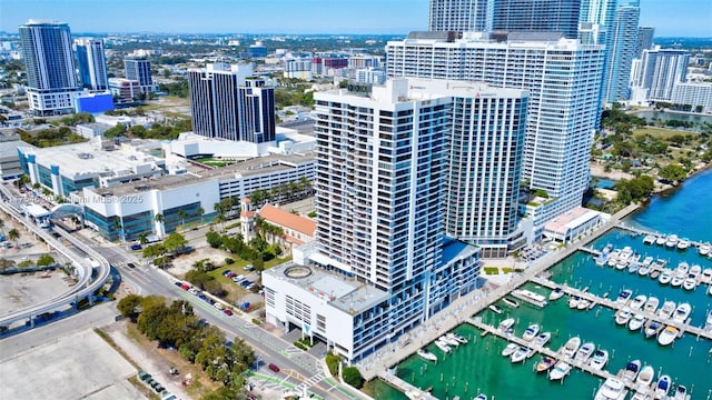 birds eye view of property featuring a view of city and a water view