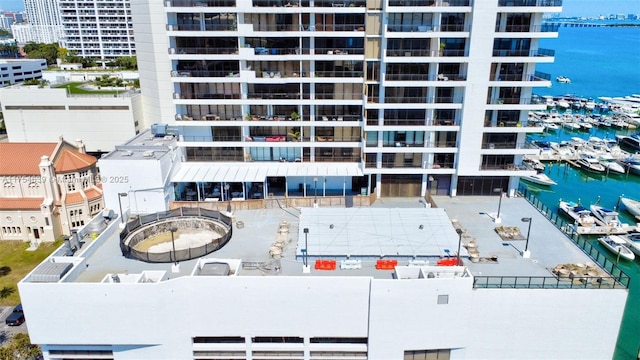 drone / aerial view featuring a view of city and a water view