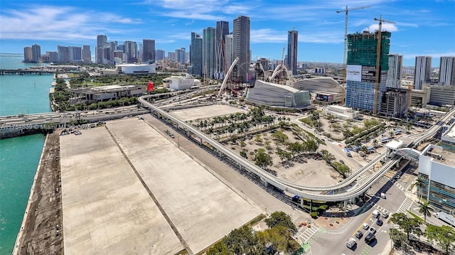 drone / aerial view with a view of city and a water view