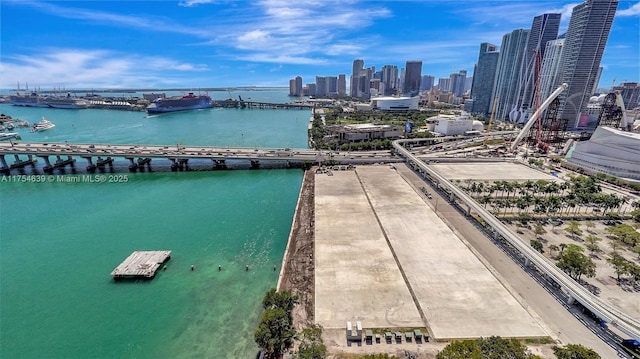 bird's eye view featuring a water view and a city view