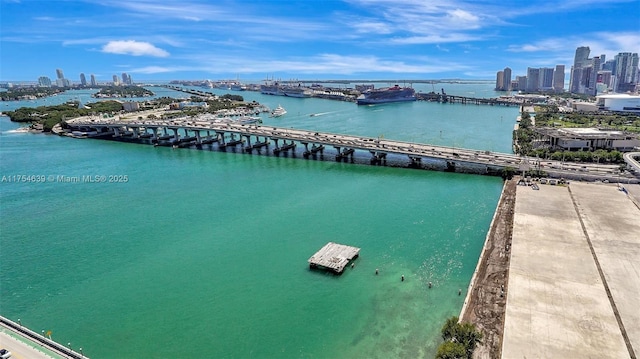 aerial view featuring a water view and a city view