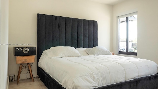 bedroom with wood finished floors