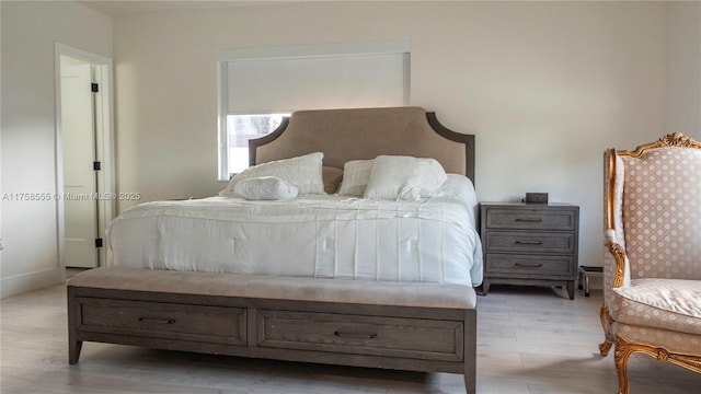 bedroom with light wood-style floors