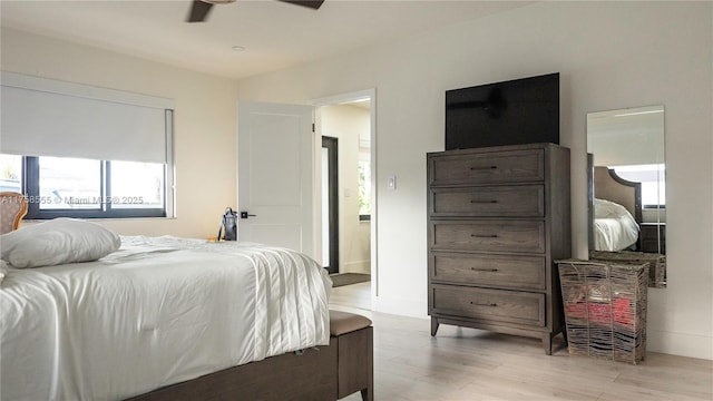 bedroom featuring a ceiling fan and light wood-style flooring