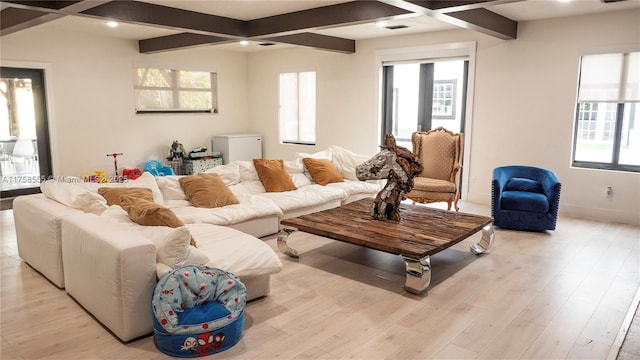 living area with light wood-type flooring, beam ceiling, baseboards, and recessed lighting