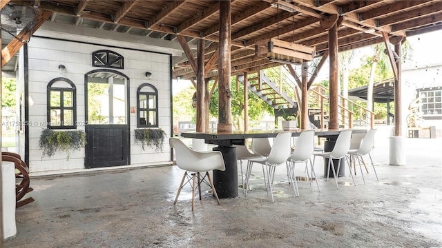 view of patio with stairs and outdoor dry bar