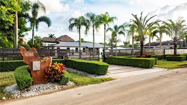 view of home's community with fence