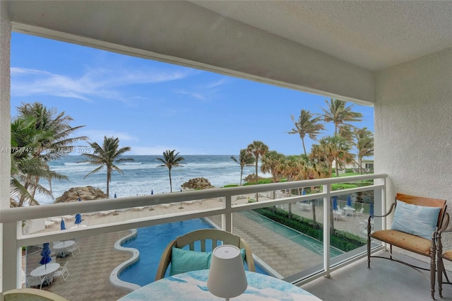 balcony featuring a water view