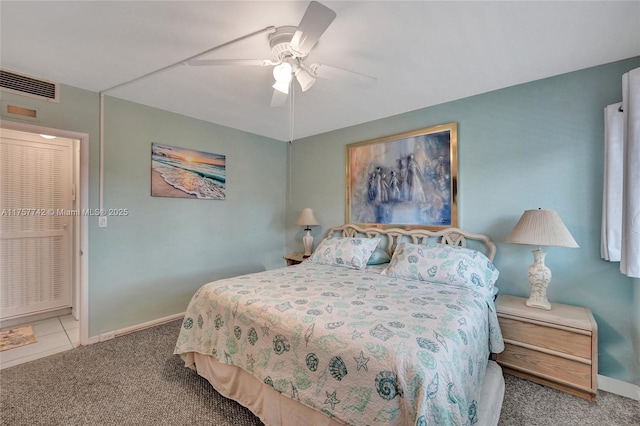 bedroom featuring carpet floors, visible vents, baseboards, and a ceiling fan