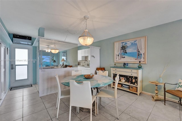 dining room with light tile patterned flooring and baseboards