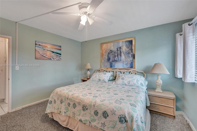 carpeted bedroom with a ceiling fan and baseboards